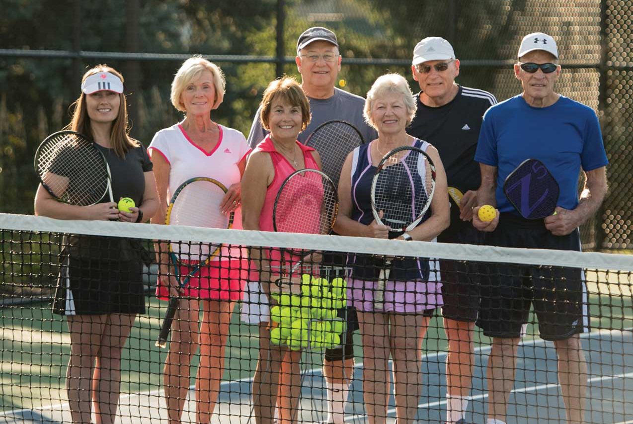 Residents enjoying a game of tennis