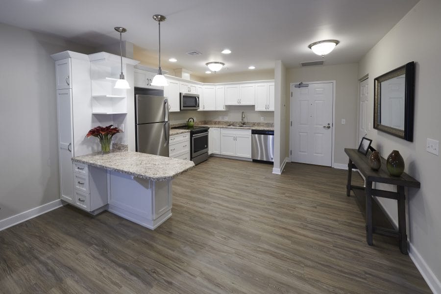 The kitchen and living space of a retirement apartment at Woodcrest Villa