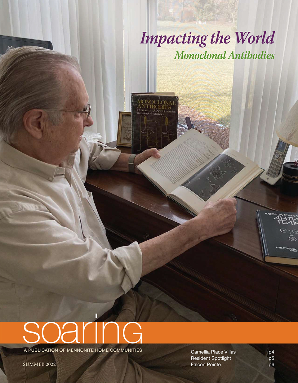 A resident reading a book on the cover of the Summer 2022 Soaring Newsletter